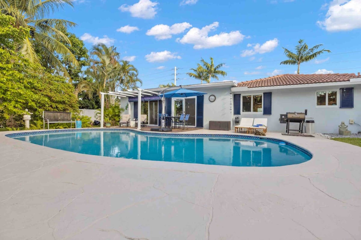 Canal-side home with dock, heated pool & canoe