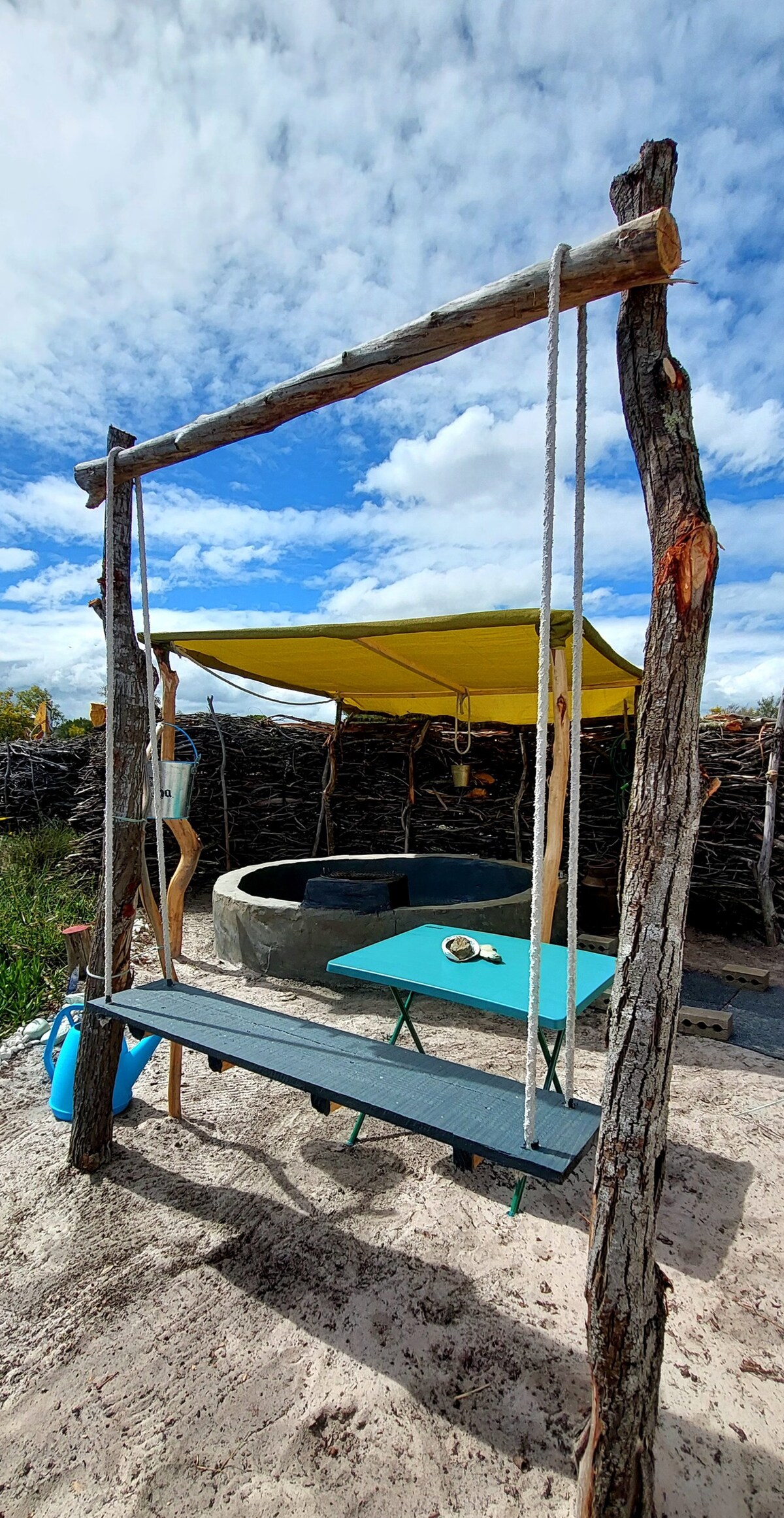 Camping tent with outdoor bathtub on artist's land