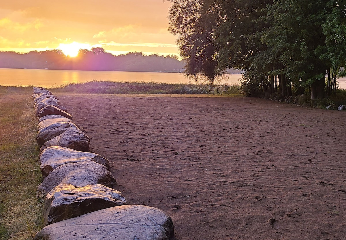 Woodland Riverfront Sunset Chalet