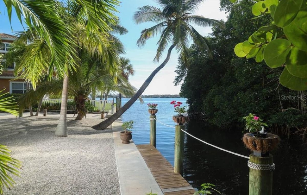 Waterfront home with heated pool walk to Beach!