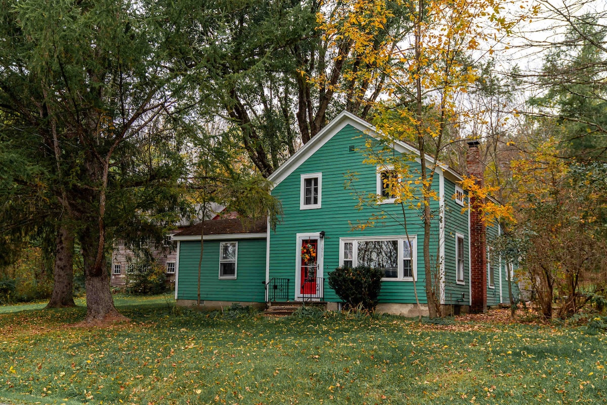 Cozy creekside home with a dreamy yard and trails