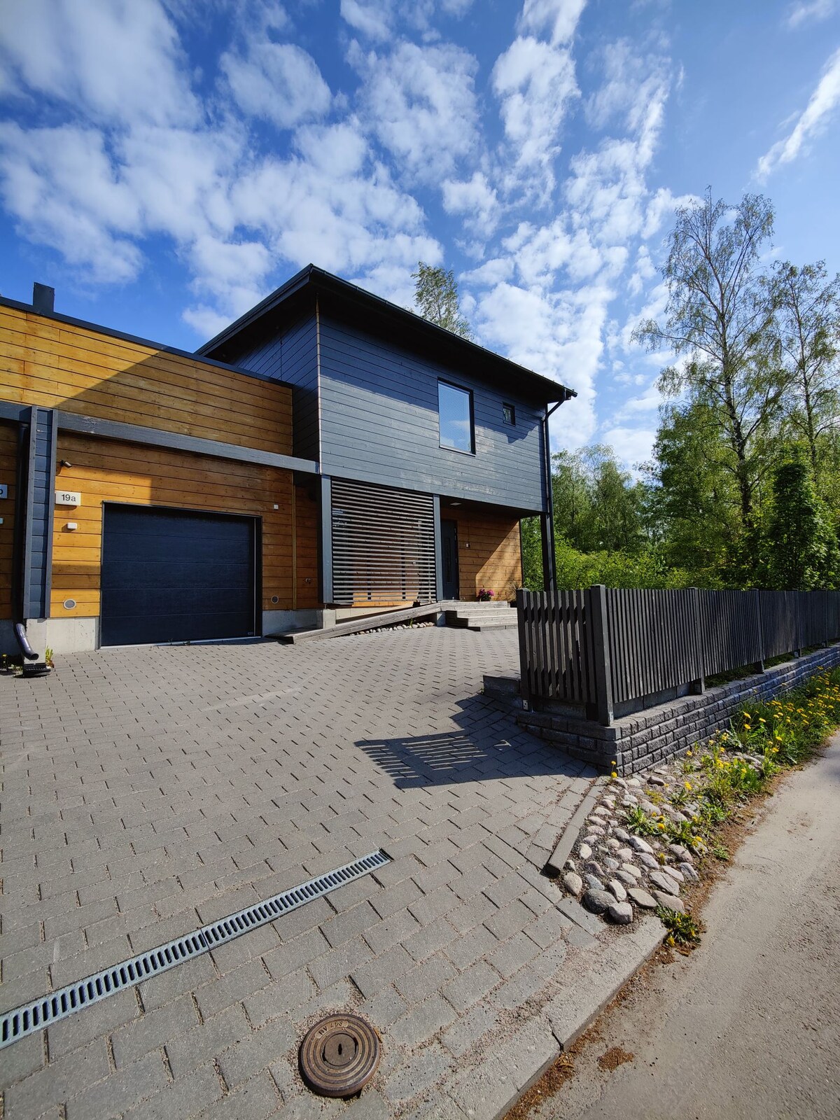 Modern wooden log house with jacuzzi