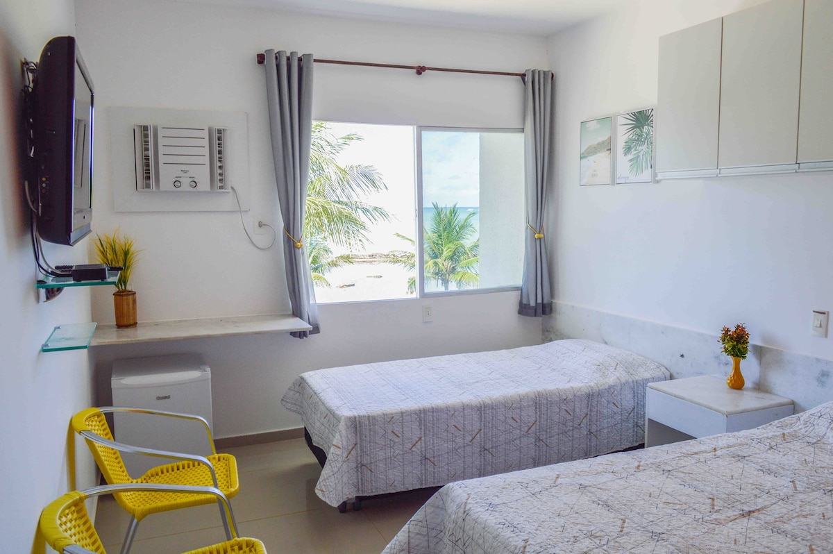 位于普拉亚多斯卡内罗斯（ Praia dos Carneiros ）的海滨天堂的酒店式公寓。