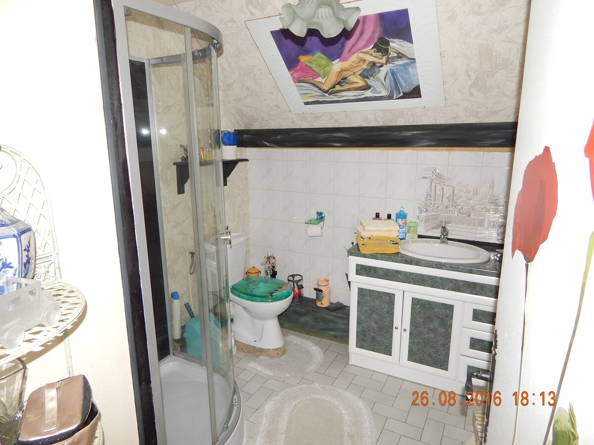 Very roomy room with balcony, private bathroom.