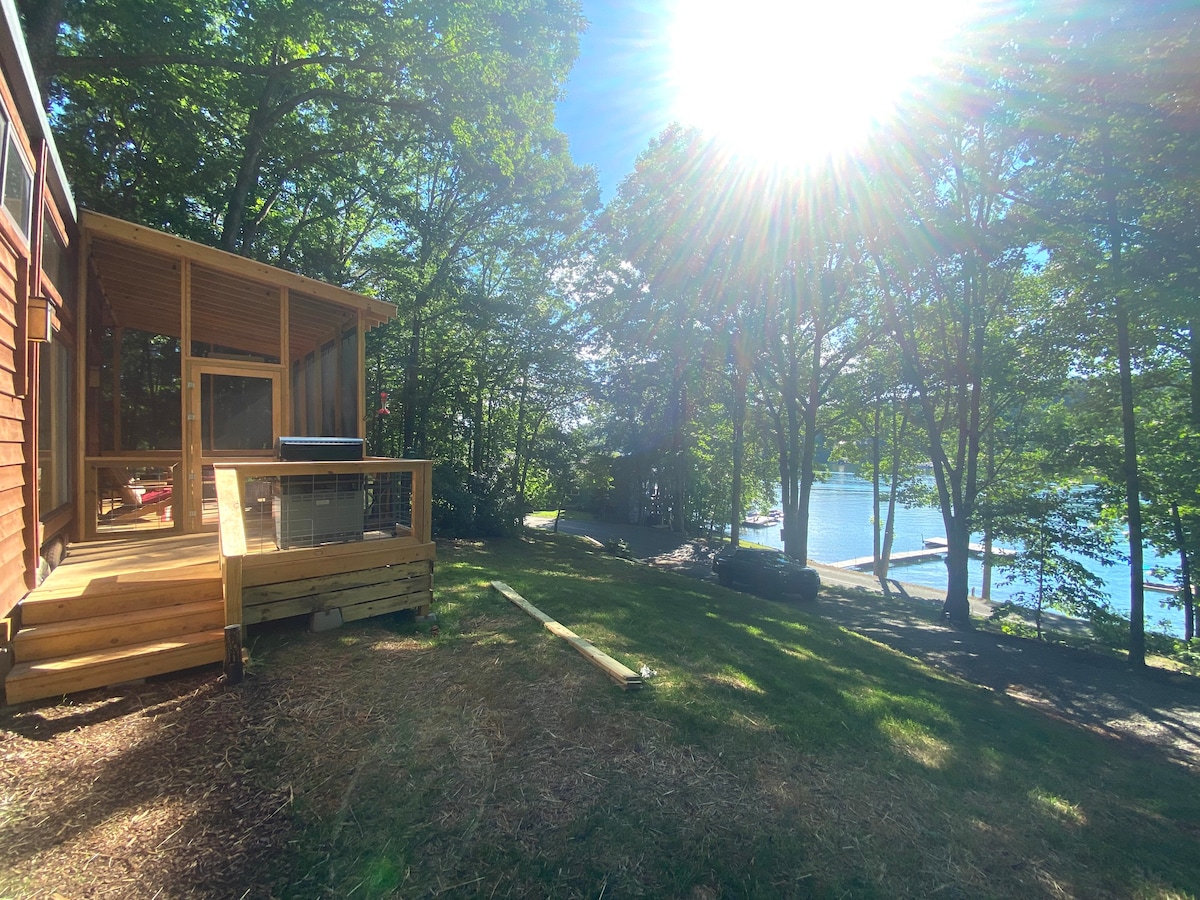 Beautiful tiny home perched on a lake front lot.