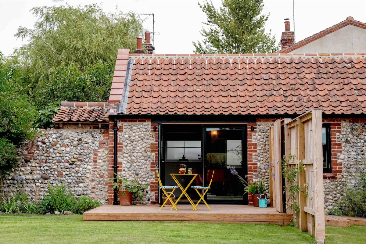 A converted brick and flint outbuilding
