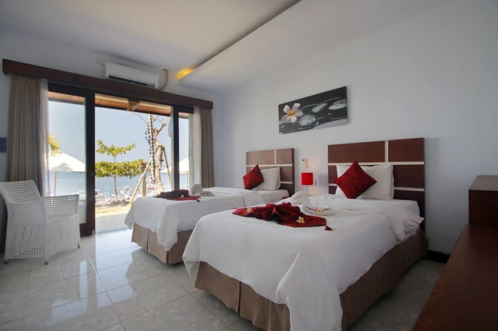 Room by the amed beach view & beautiful sunrise.