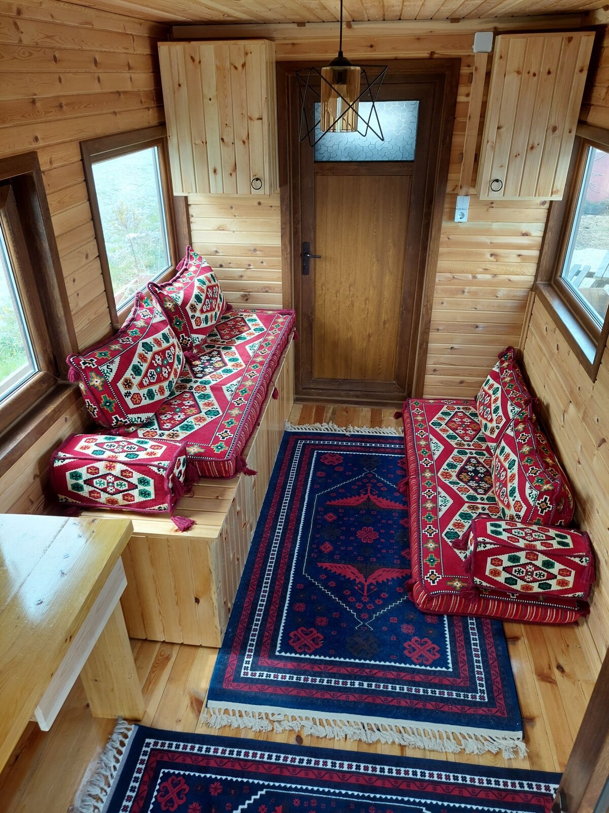 wooden Tiny house in village surrounded by nature