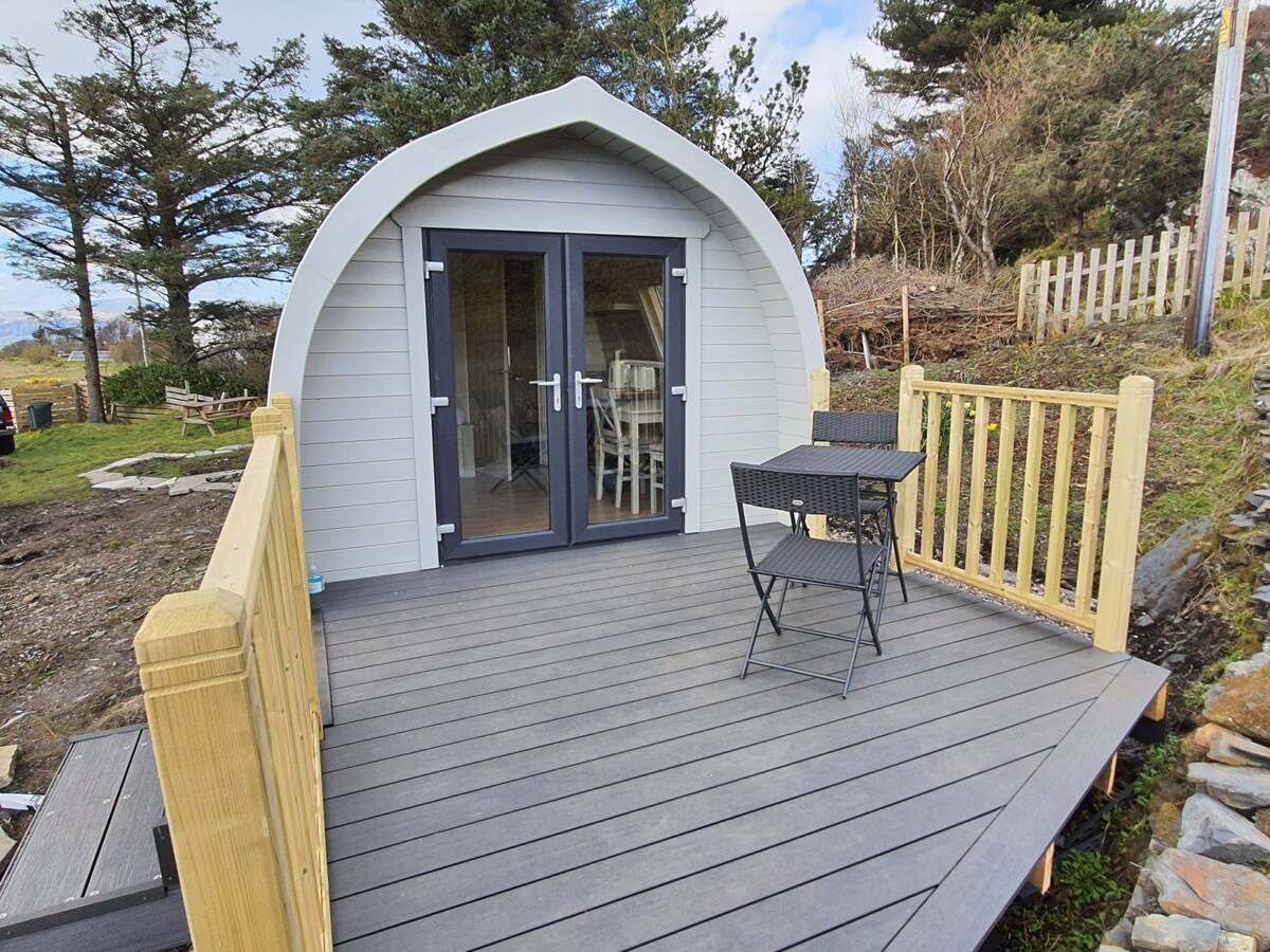 Superior pod with decking by the sea