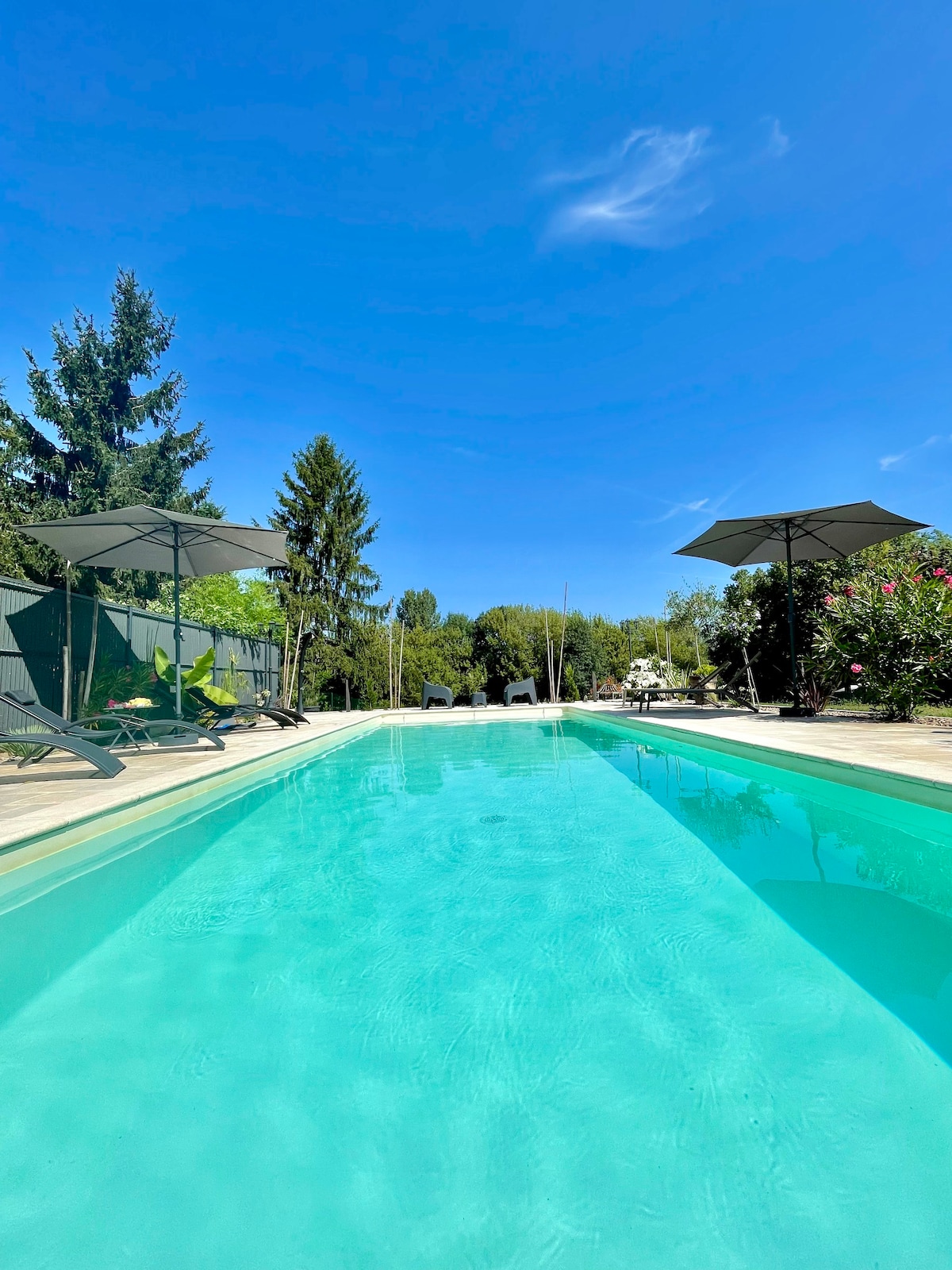 Private heated pool with river view