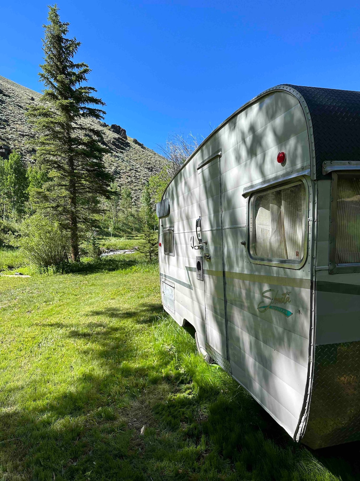 Peaceful Riverside Vintage Shasta Camper