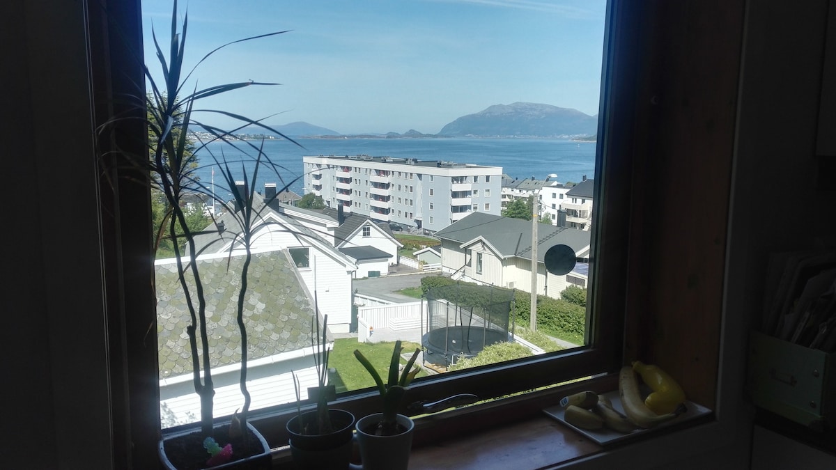 An apartment with a view of the Ålesund city.