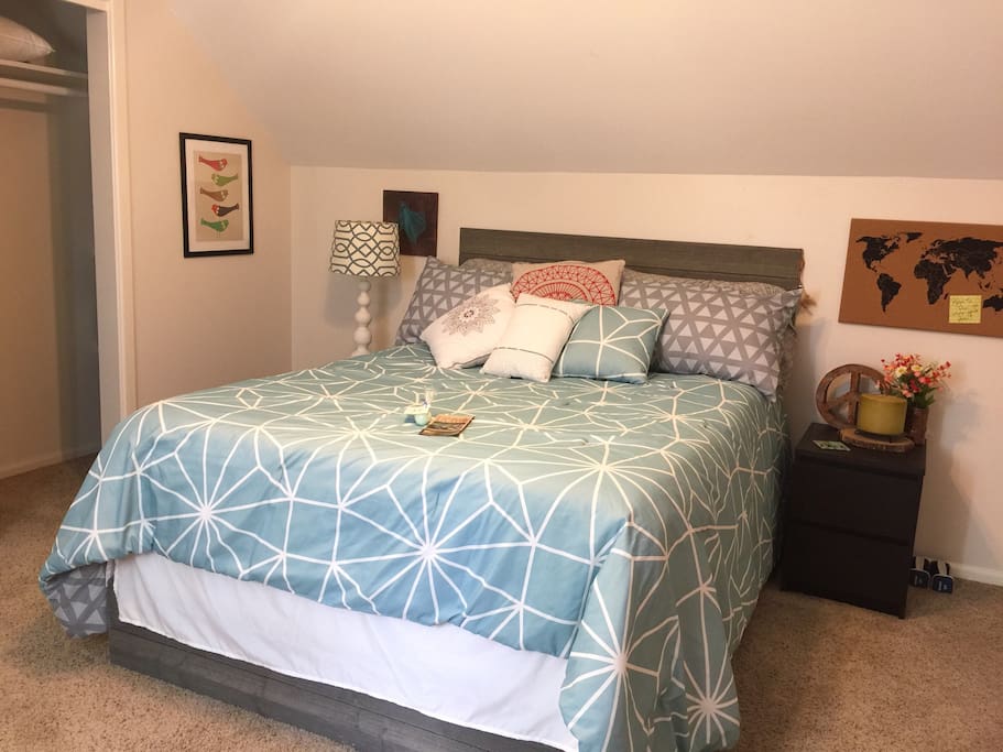 queen sized bed with storage drawers under the bed.