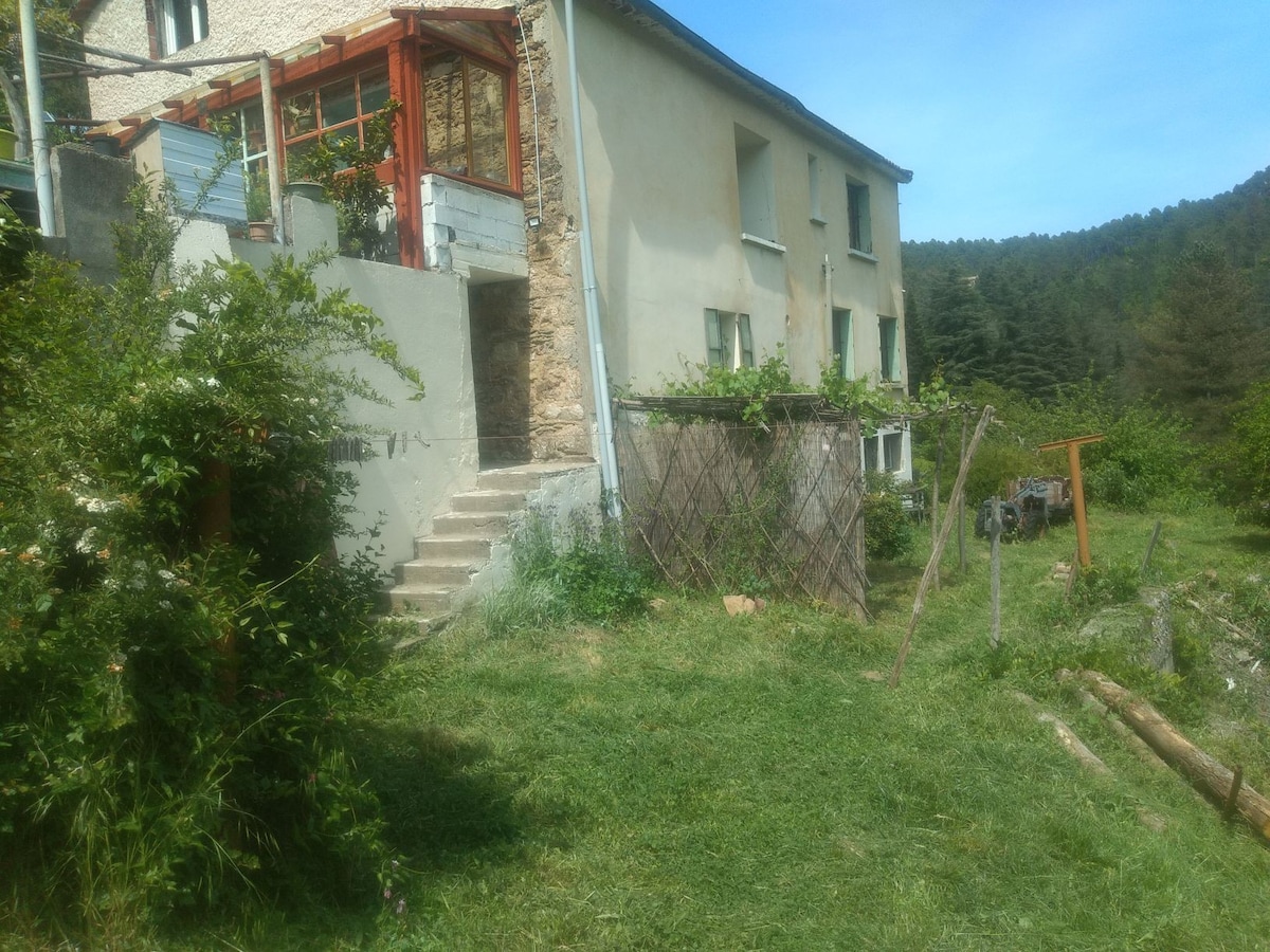 In the Cévennes, house in the woods with waterfall