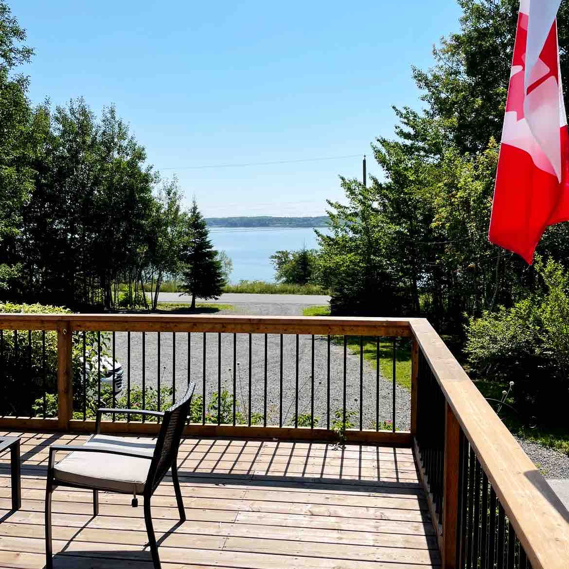 Waterfront homestead on 4 landscaped acres.