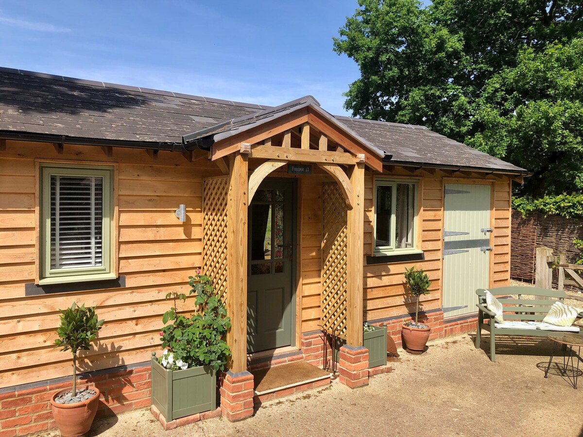 Unique stable conversion, log burner, rural view.