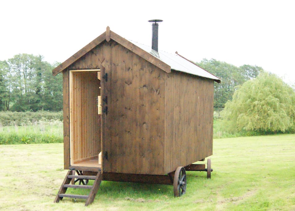 shepherds hut on secluded meadow