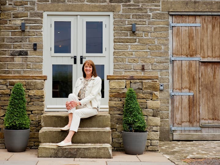 Image of Anita sitting on a staircase