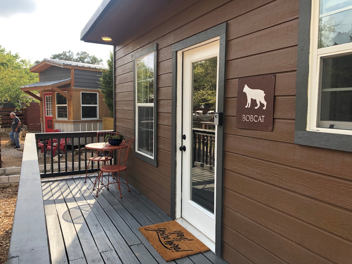 Bobcat cabin in 3 acre tiny home resort with pool!