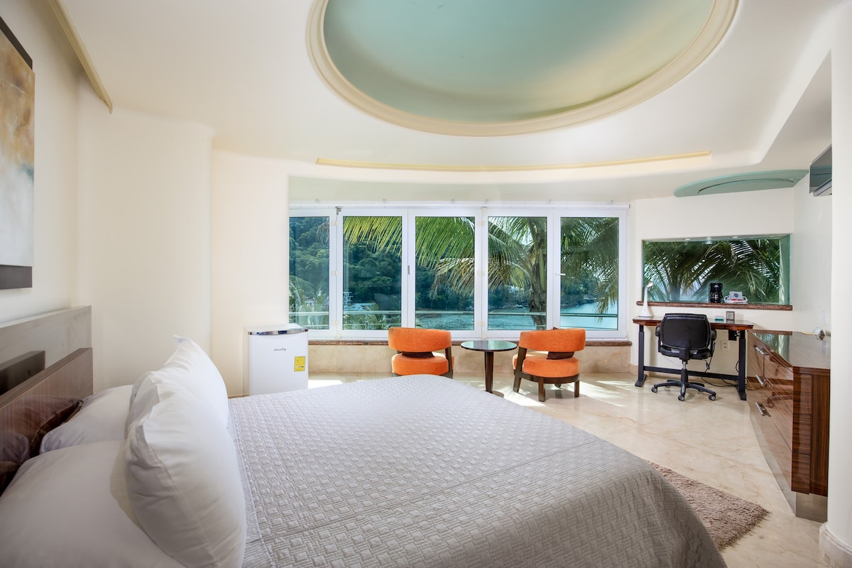 Garden suite with swimming pool and ocean views