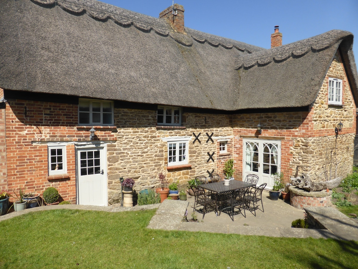 Large period thatched Cottage in charming village
