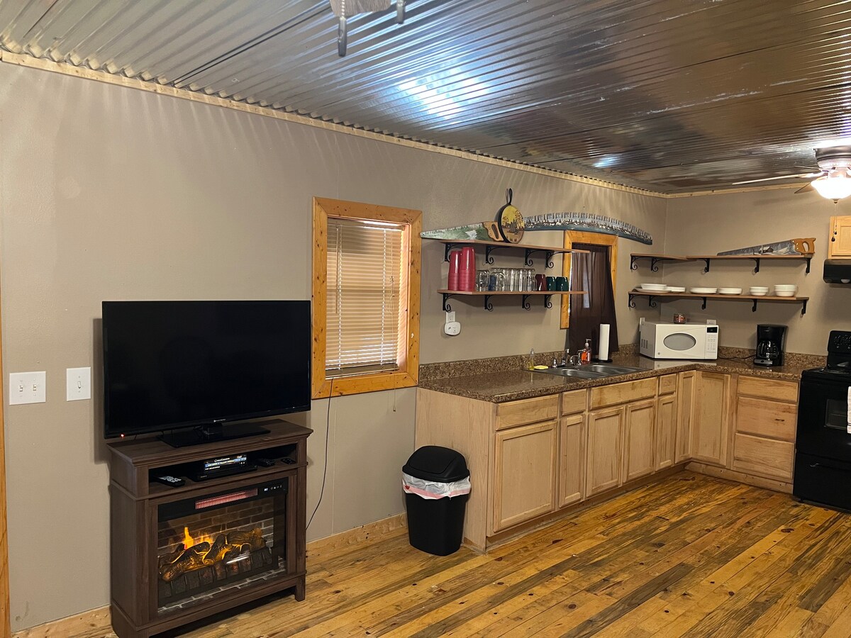 1br Cabin set against the Ozark National Forest