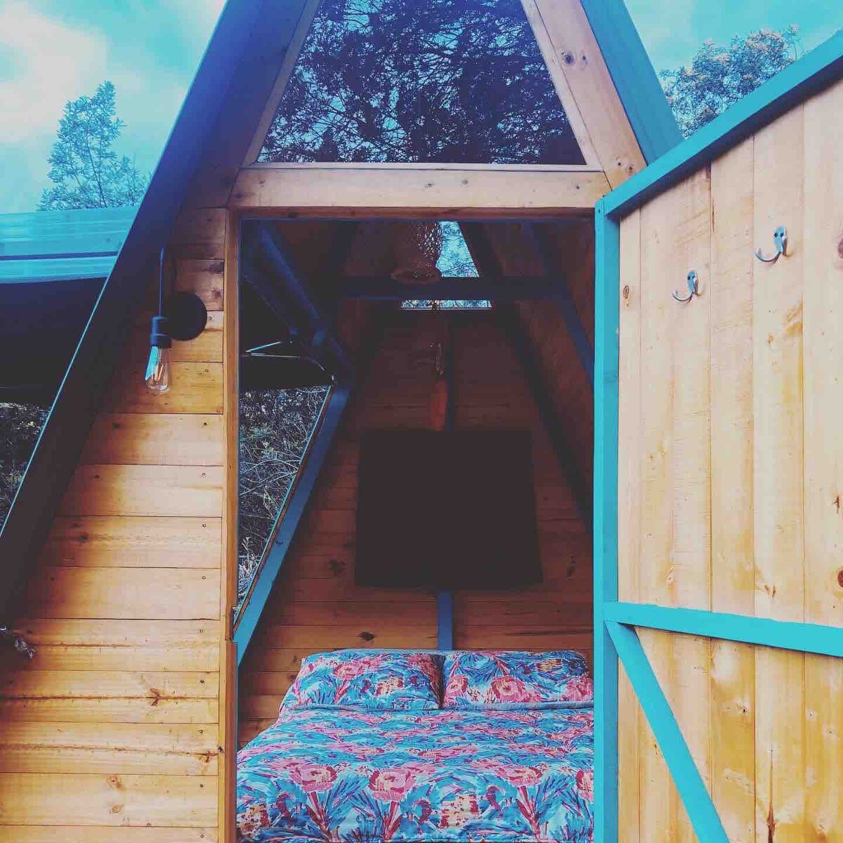 A-Frame Cabin in the woods with a mountain view