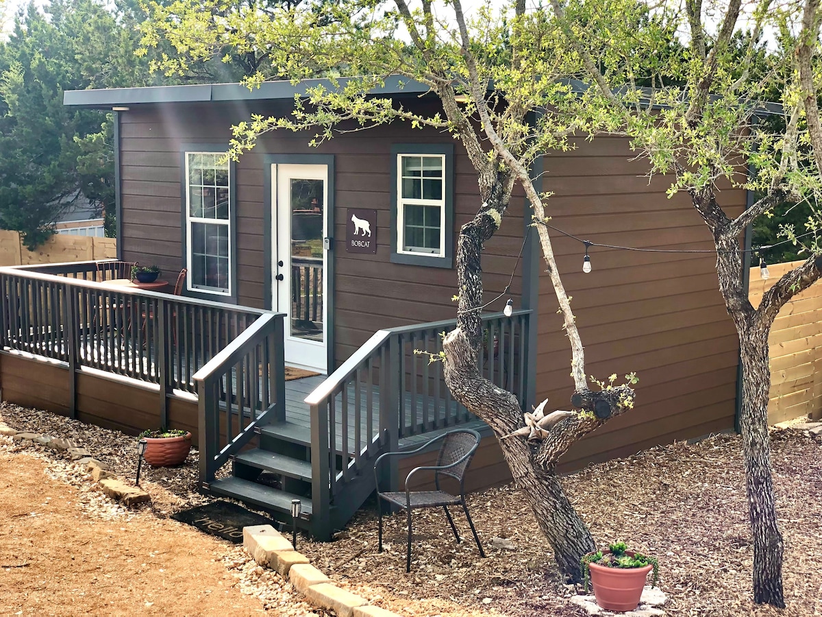 Bobcat cabin in 3 acre tiny home resort with pool!