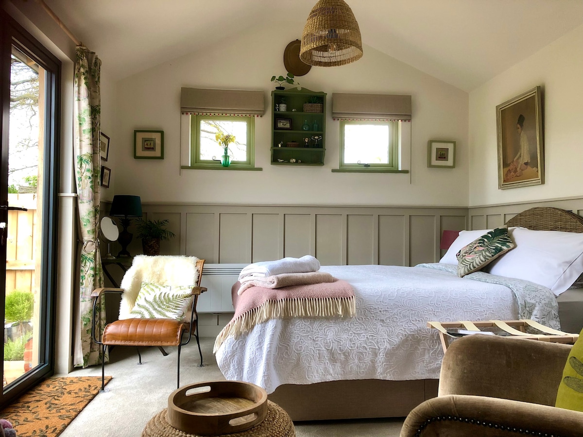 Unique stable conversion, log burner, rural view.