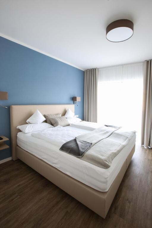 App. Hotel Fidelio (Bad Füssing), Penthouse 4 (58qm) mit riesiger Dachterrasse, Boxspringbett, Geschirrspüler und Couch