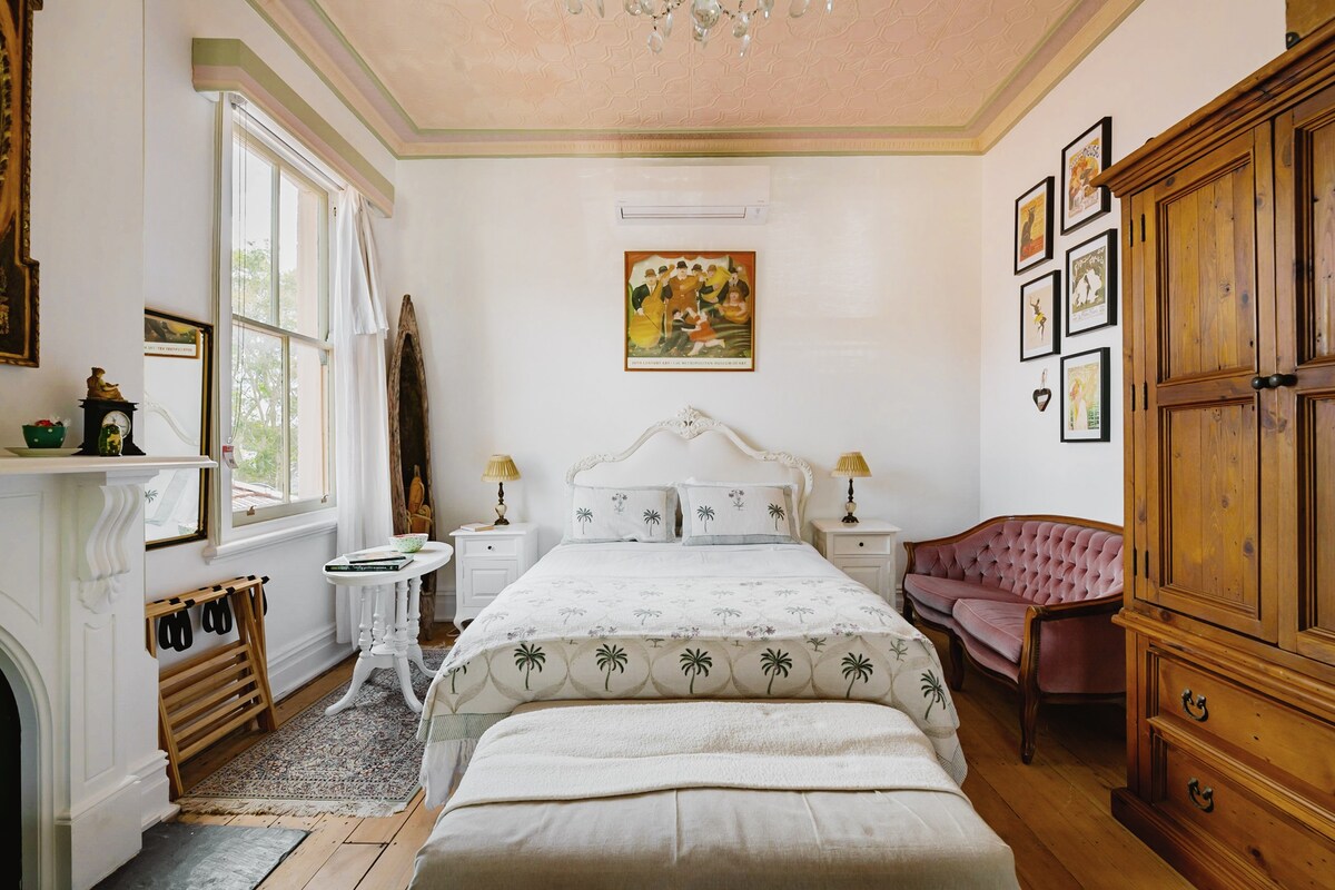 Grand Victorian room with spacious balcony.