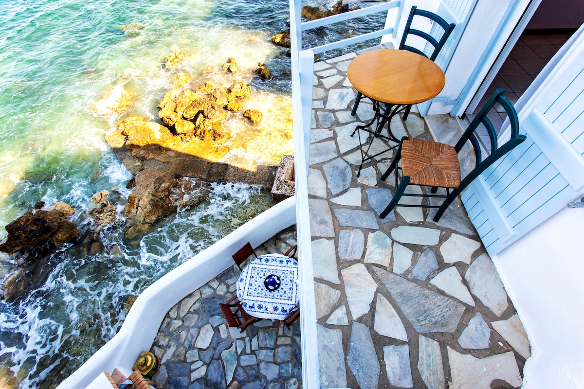 House with balcony on the sea