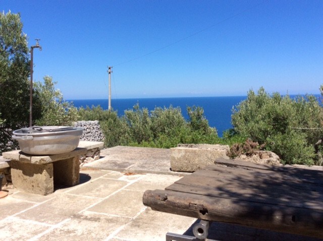 country stone house in front of the sea