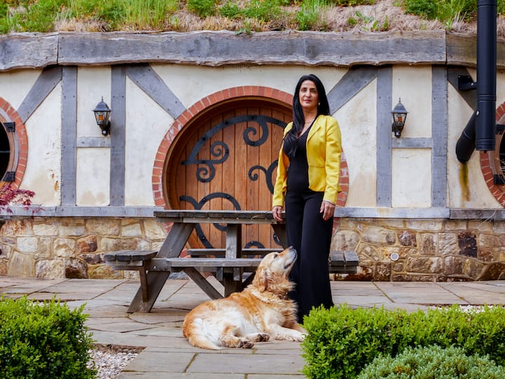 Image of America and her dog Lucy outside her listing
