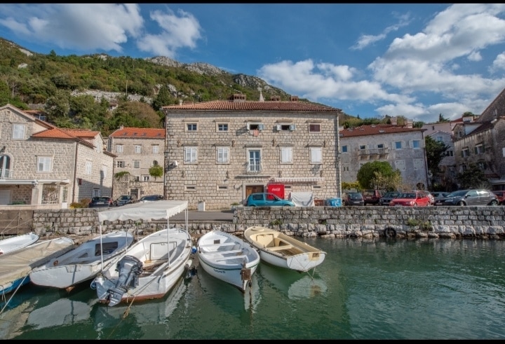 The Gem of Perast on the water's edge in Perast