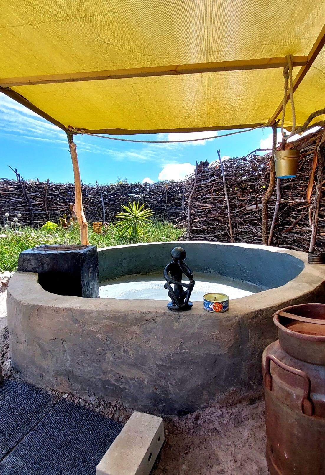 Camping tent with outdoor bathtub on artist's land