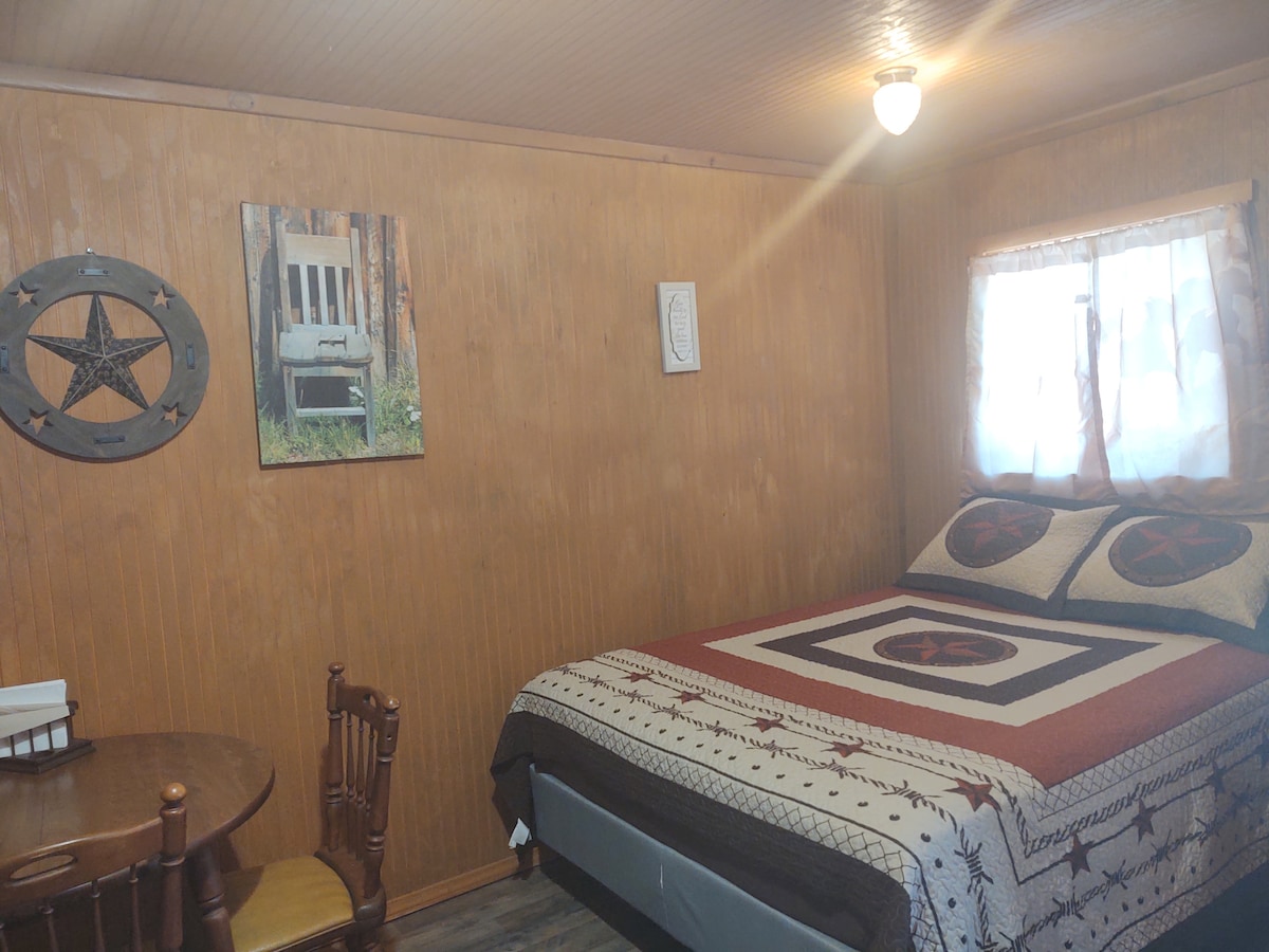 Quaint  open room with bathroom on horse farm