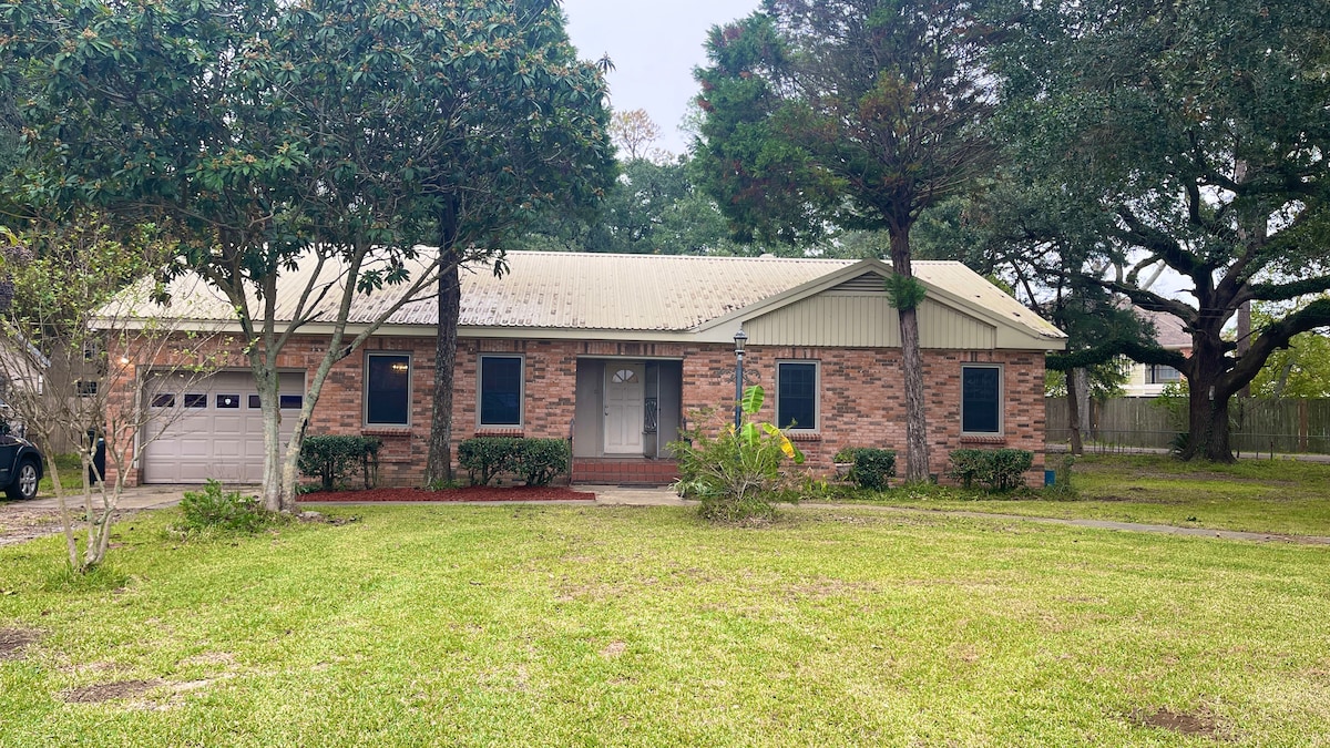 The Brickwood farmhouse among the Oaks and Pines