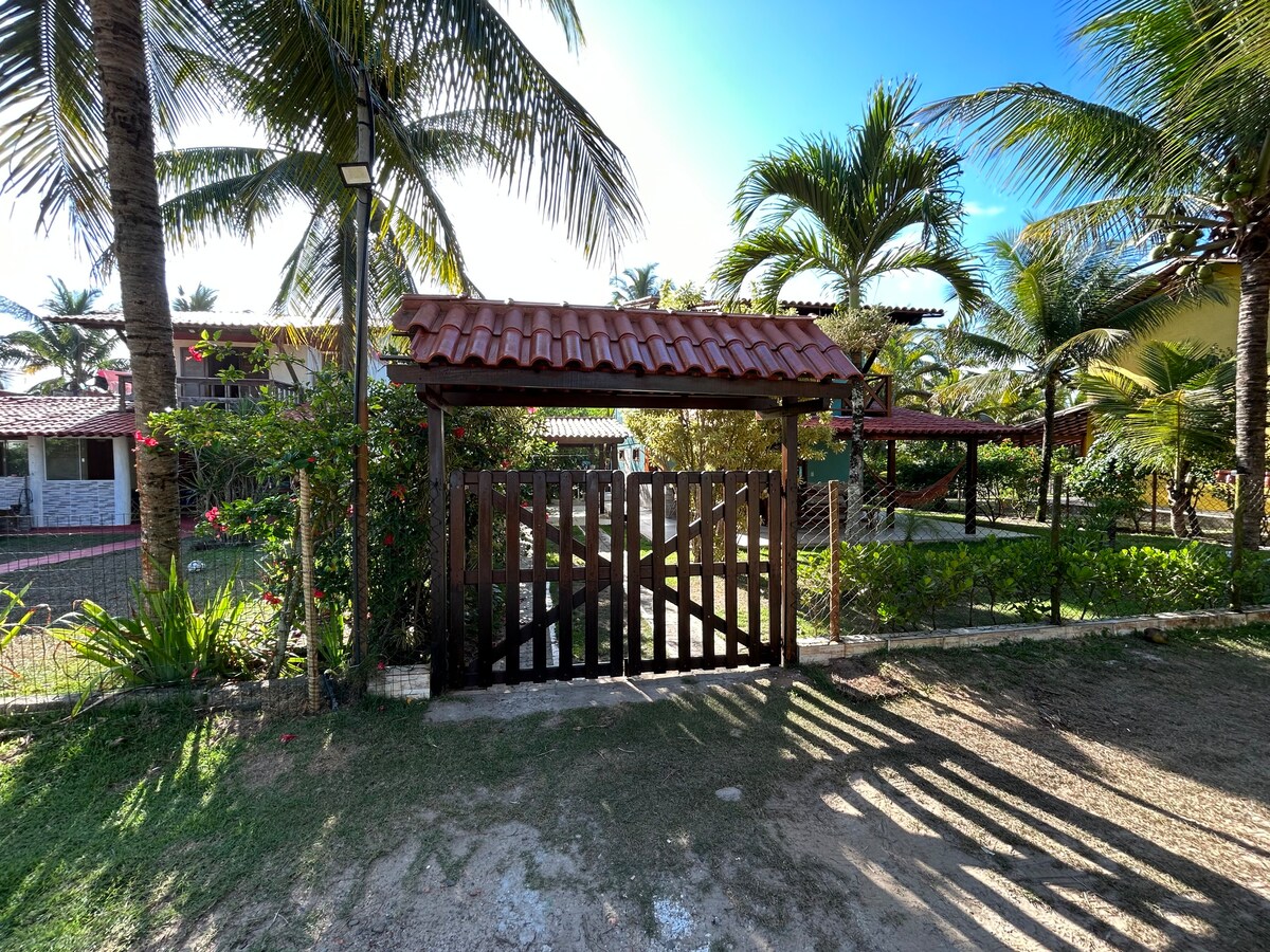 Casa de praia pé na areia: nos braços da natureza.