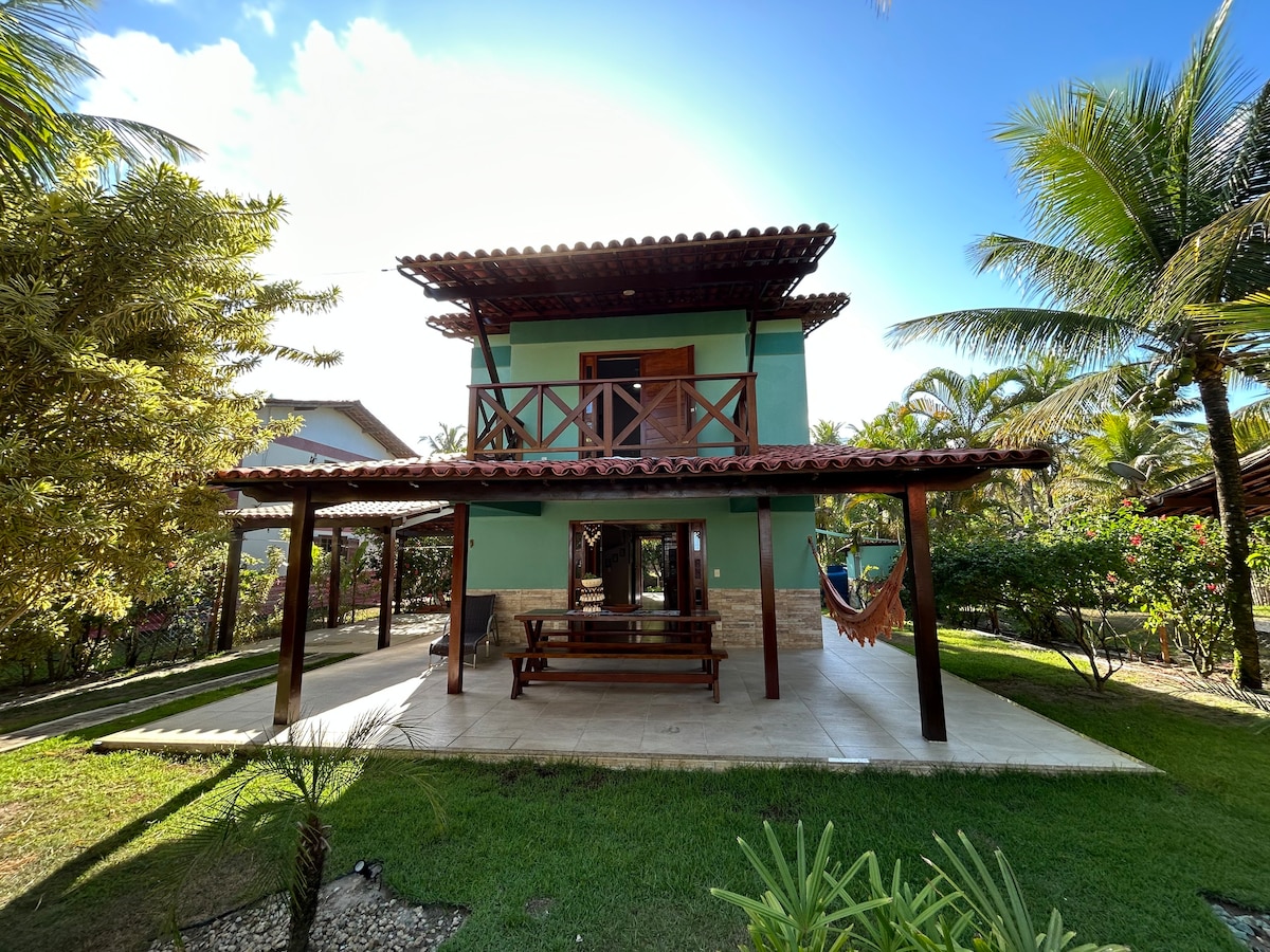 Casa de praia pé na areia: nos braços da natureza.