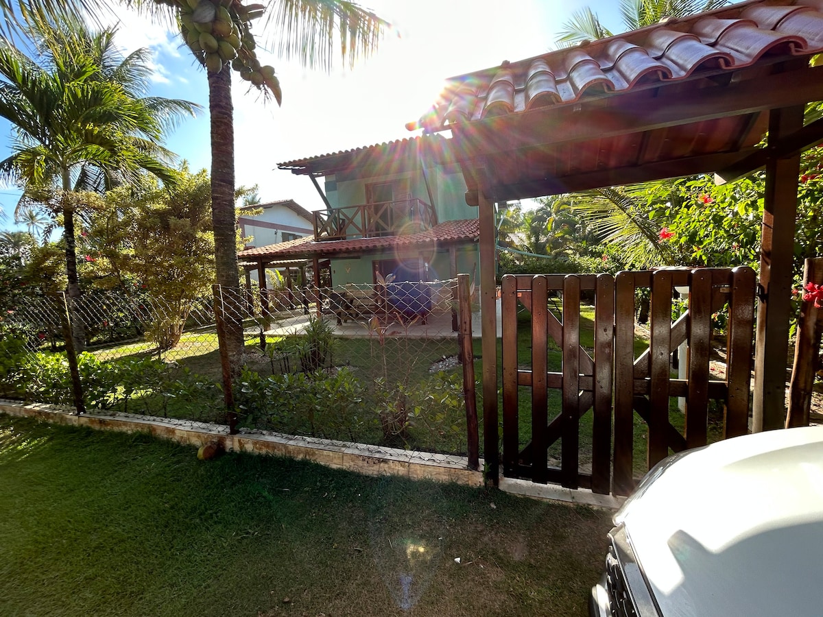 Casa de praia pé na areia: nos braços da natureza.