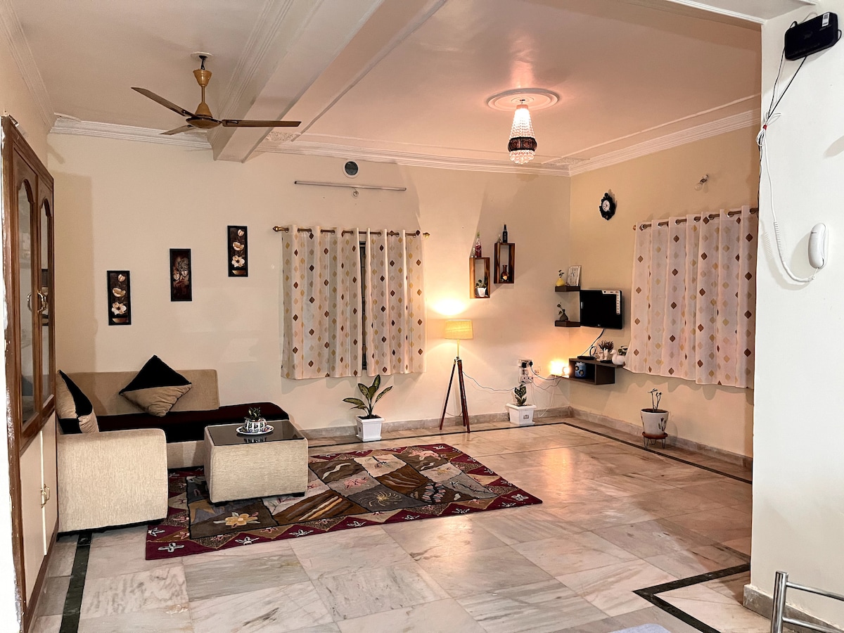 The Padma:Classy Room admist greens in a Villa