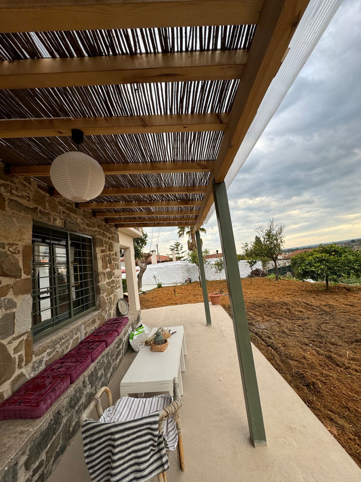 Traditional two-story stone house with view