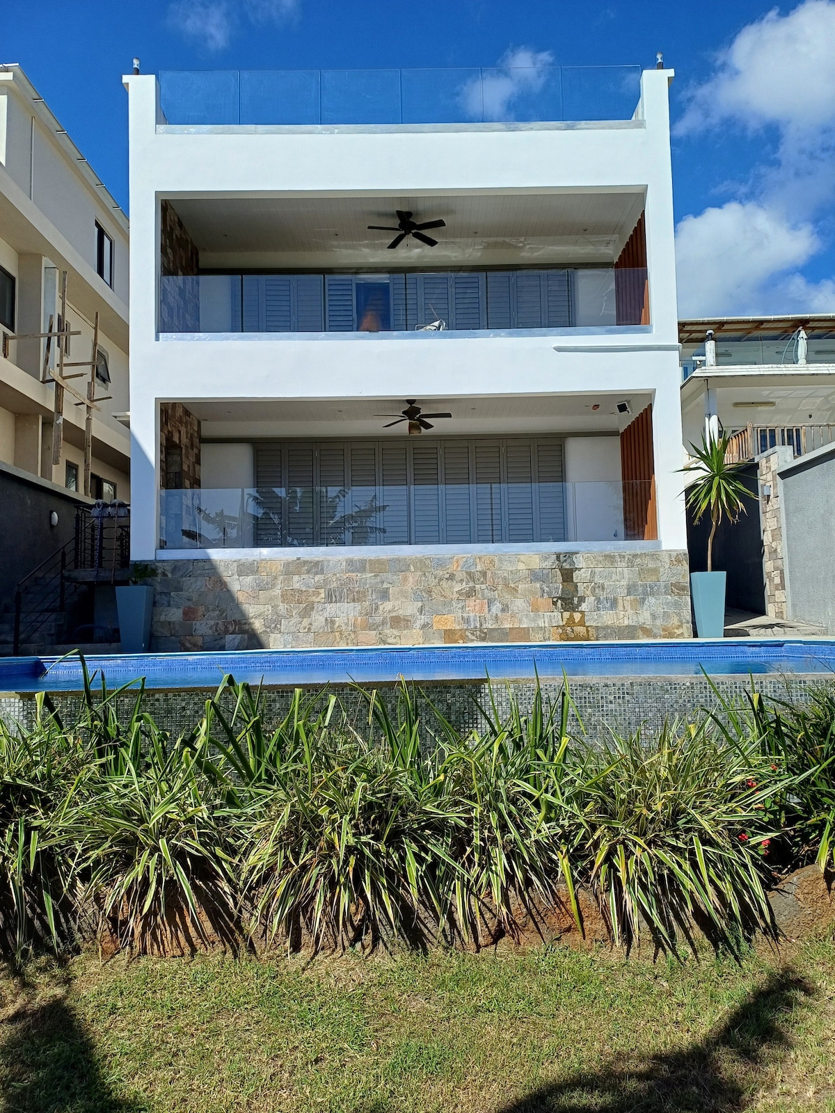 Luxury  beachfront apartment with tropical garden