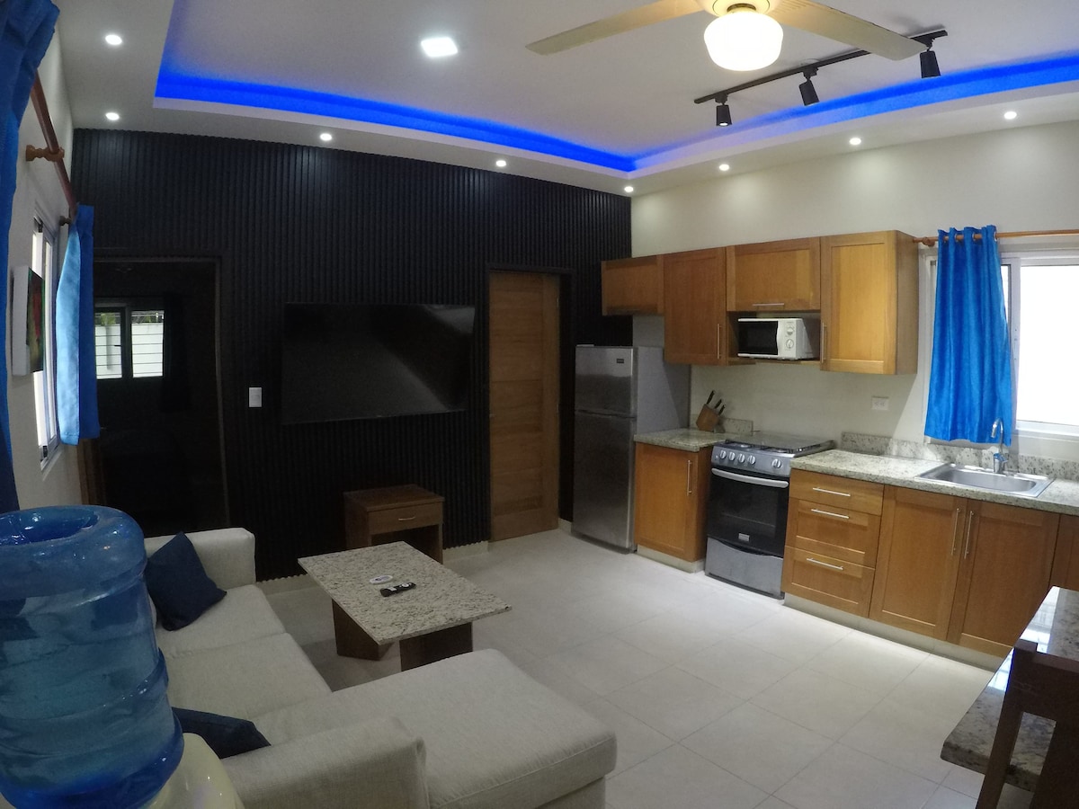 This one bedroom is super modern with two 55in tvs