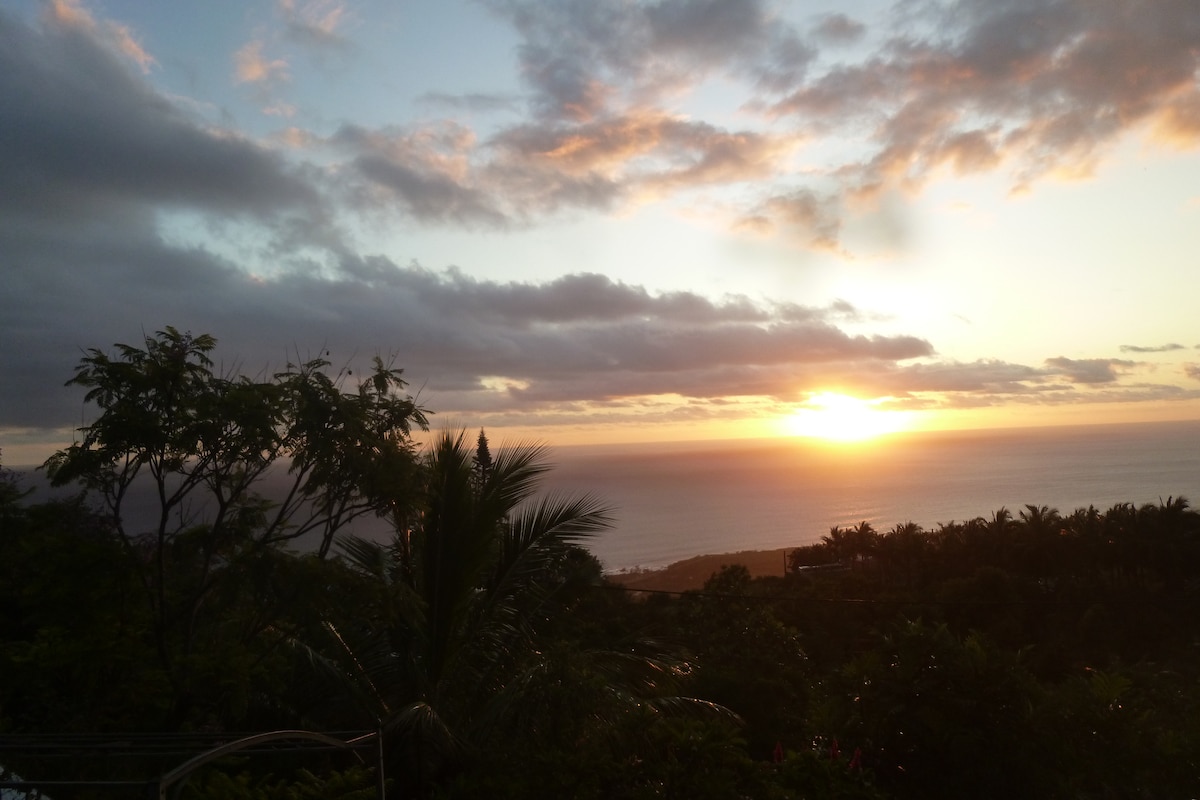 Wooden bungalow, tropical garden, sunset sea view