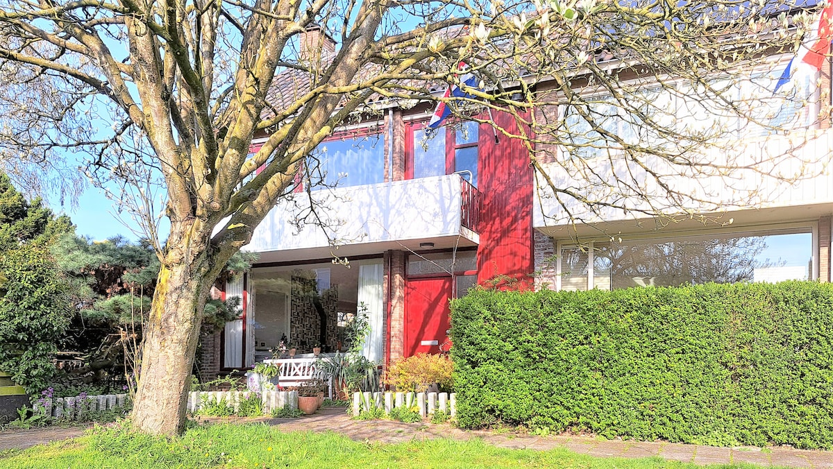 House with garden at water front near the beach