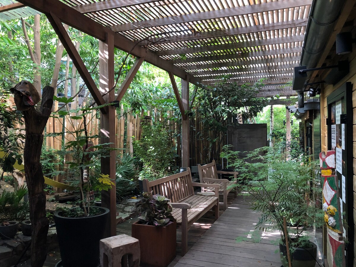 Studio set in a lush courtyard