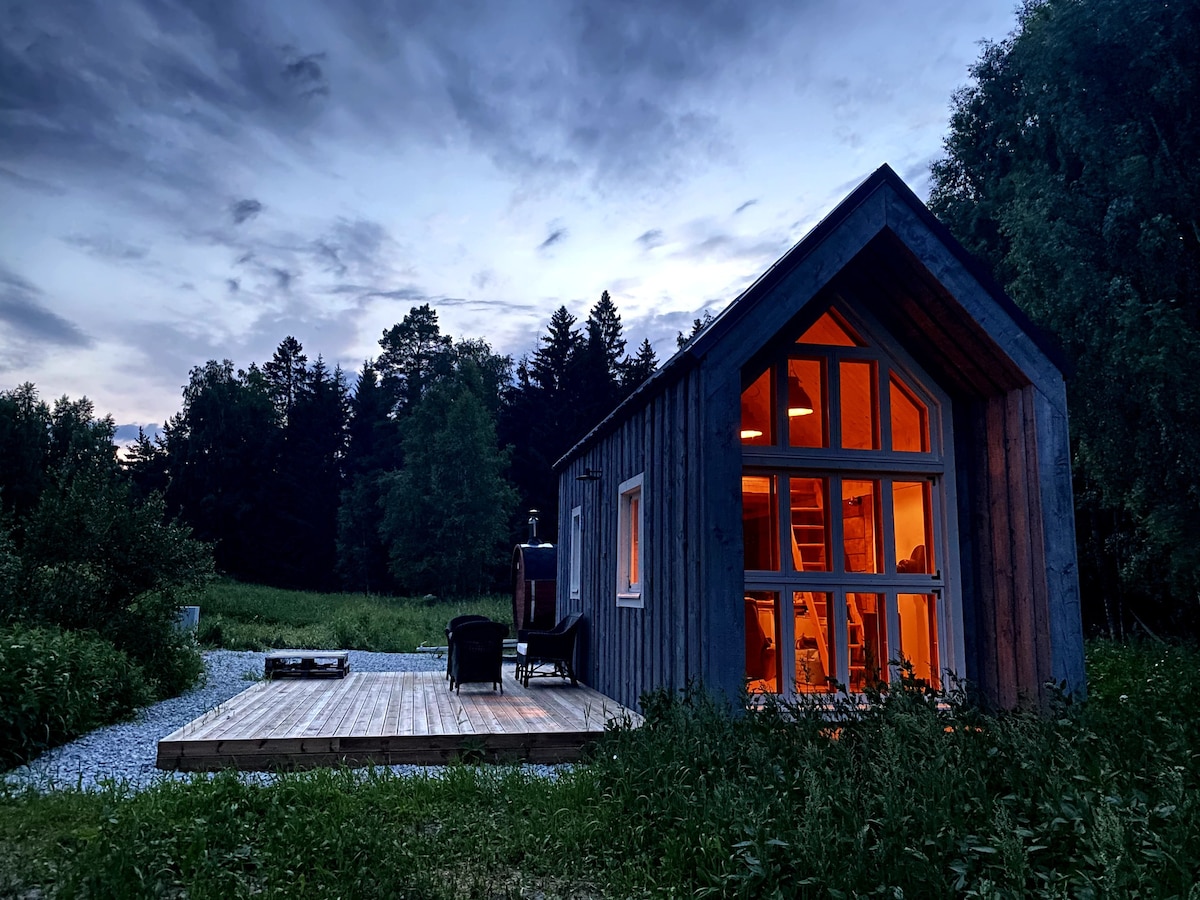 Tiny sustainably built house near the lake and sea