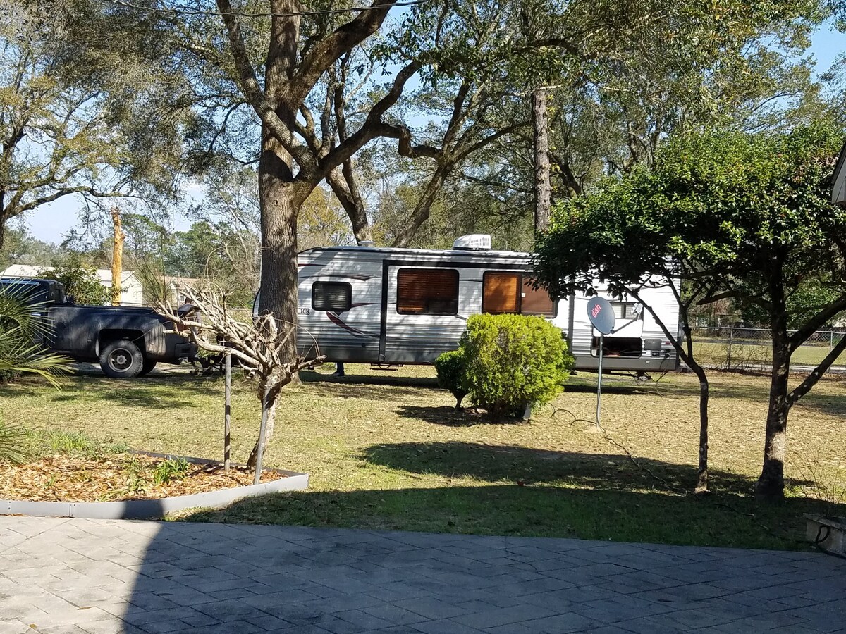 Camp site with 50 amp, water, septic fenced yard